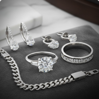 Platinum jewellery styled on a dark background